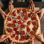 La imagen 2 de la Empresa RESTAURANTE SNACK BAR PIZZERÍA EL GRASPO DE UVA Tienda de comestibles gourmet en Medellín ANT